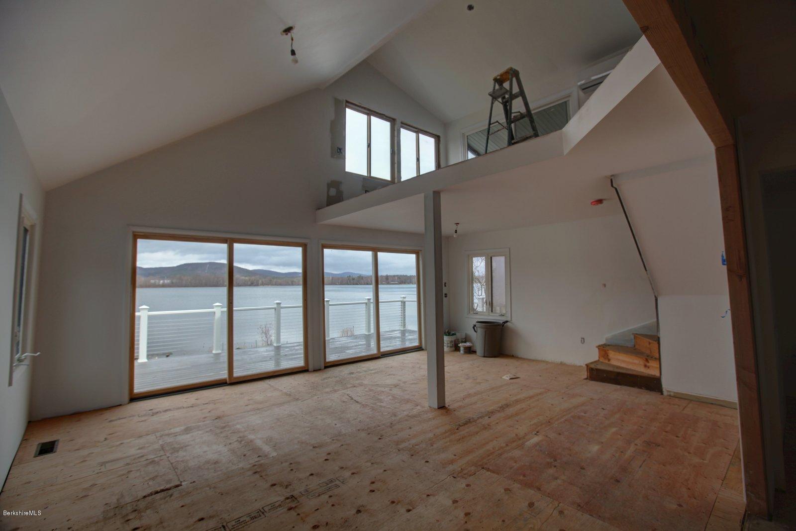 33 East Beach Road Richmond, MA 01201 - Photo 1 of 1 a view of a livingroom with a staircase
