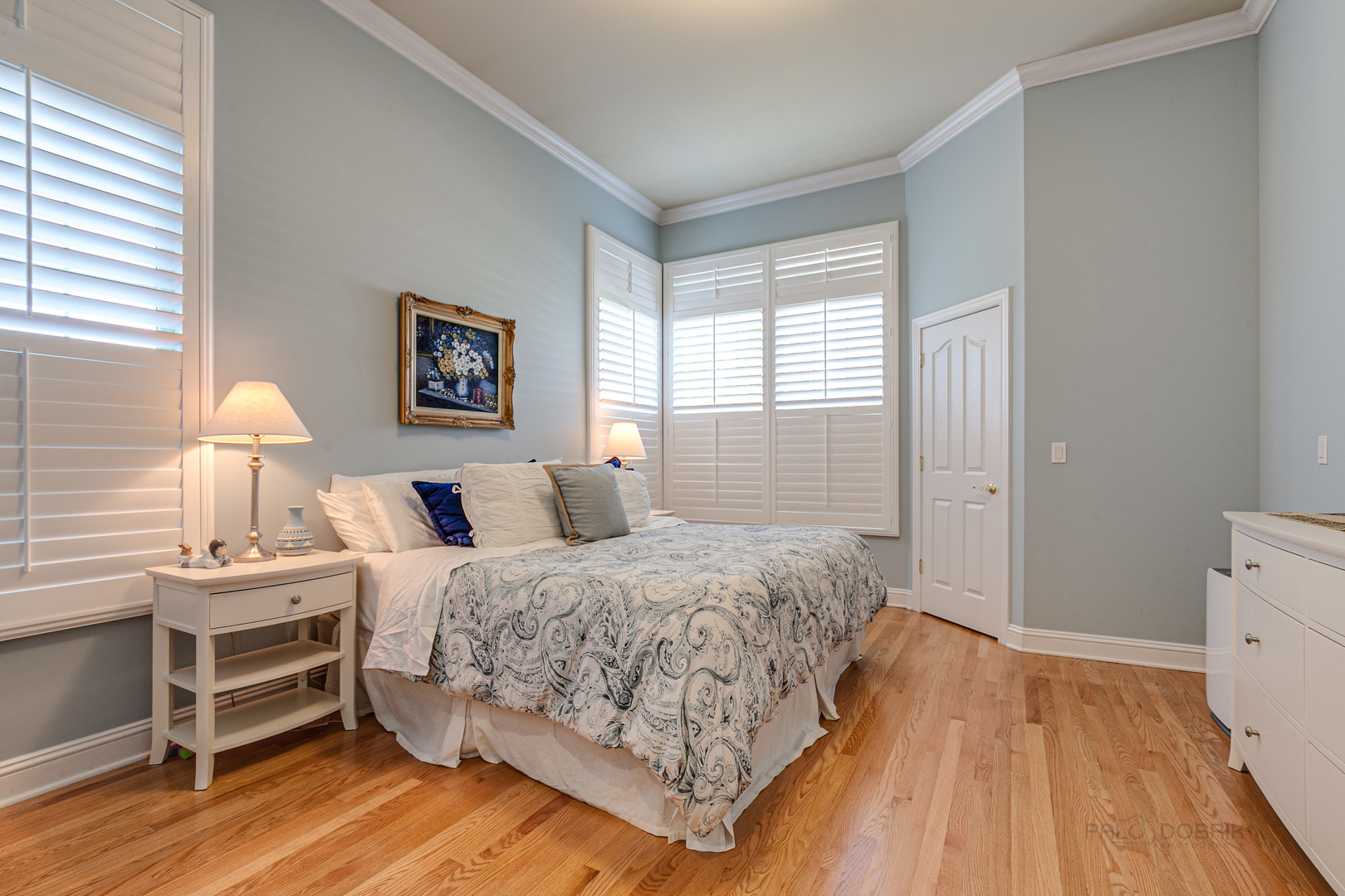 920 Symphony Drive Lake Forest, IL 60045 - Photo 16 of 28 a bedroom with a bed and a lamp on dresser