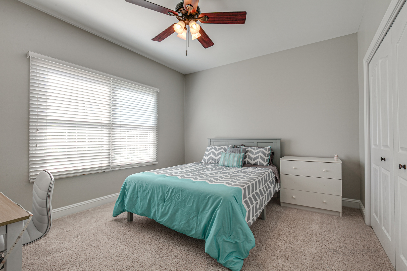 920 Symphony Drive Lake Forest, IL 60045 - Photo 21 of 28 a bedroom with a bed and a chandelier