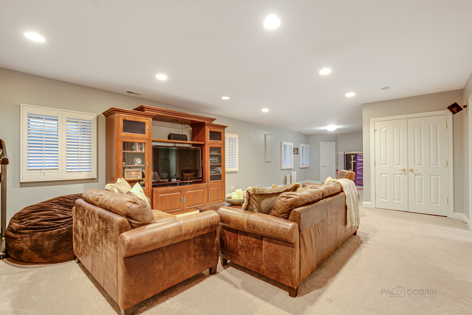 920 Symphony Drive Lake Forest, IL 60045 - Photo 24 of 28 a living room with furniture and a flat screen tv