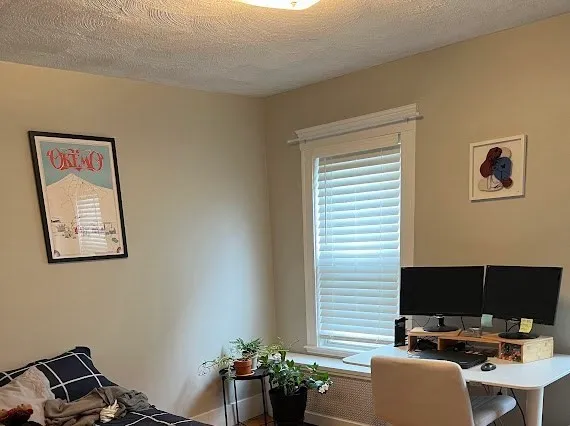 a view of a workspace with furniture