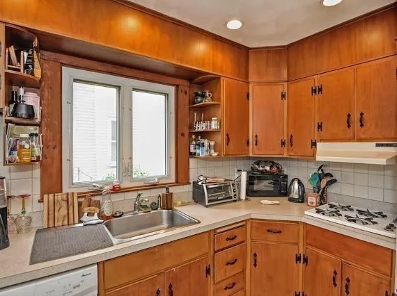 a kitchen with a sink and cabinets
