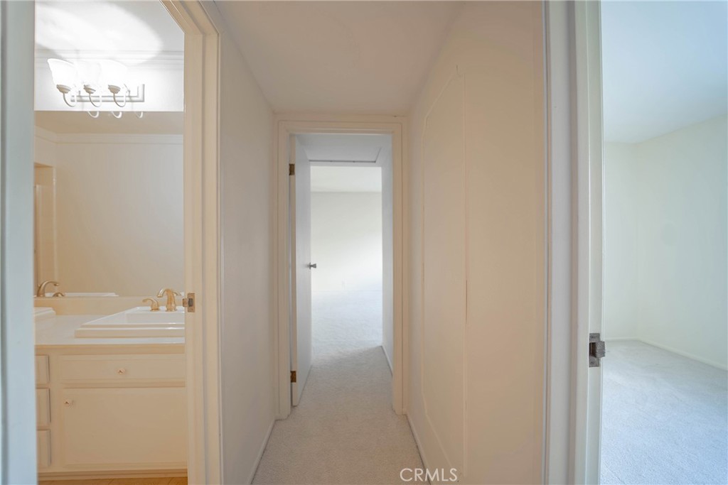 25401 Helena Circle Mission Viejo, CA 92691 - Photo 18 of 38 UPSTAIRS PRIMARY BEDROOM HALLWAY