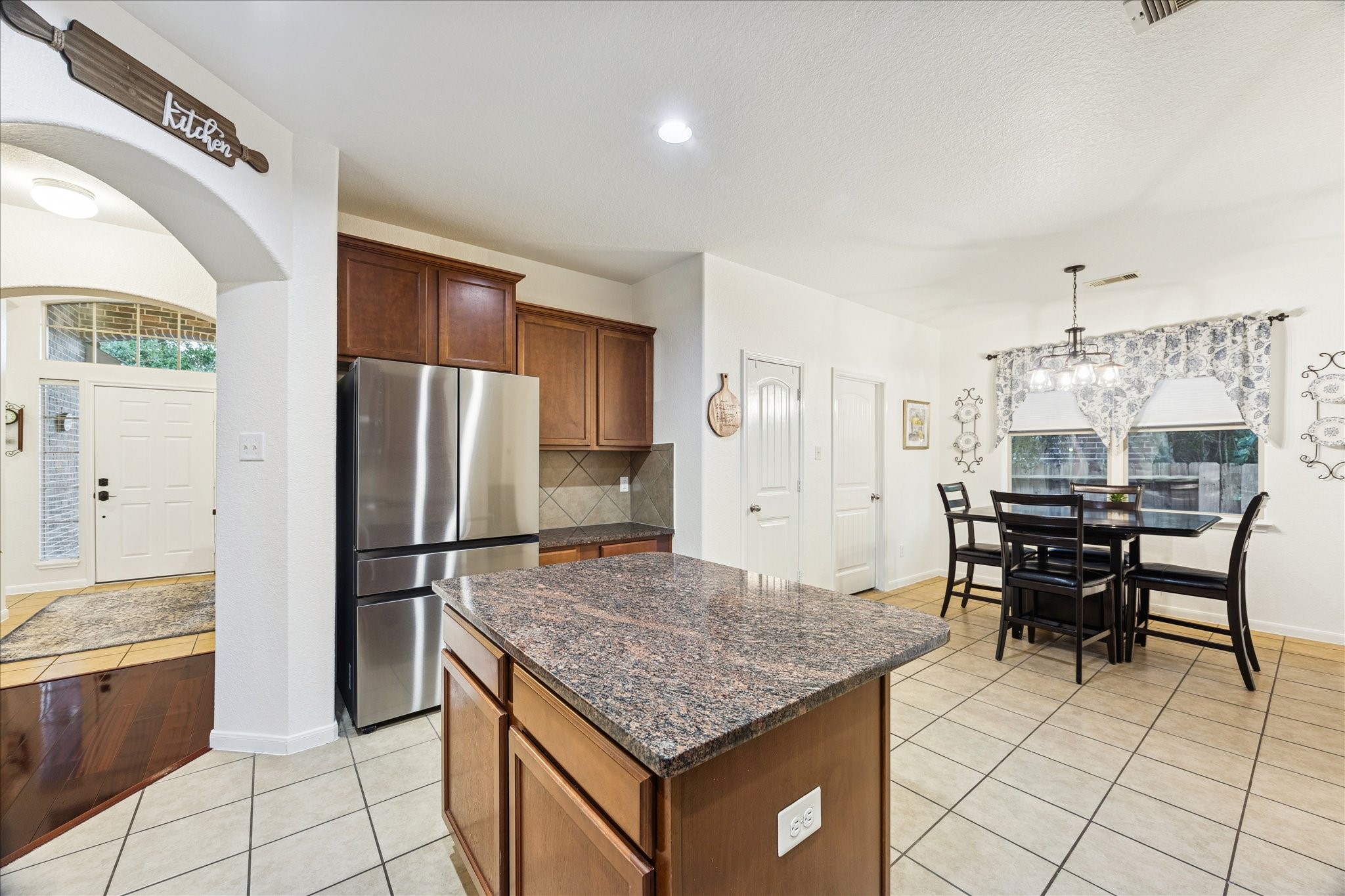 191 Maple Grove Drive Conroe, TX 77384 - Photo 12 of 31 a kitchen with kitchen island a counter top space appliances and cabinets