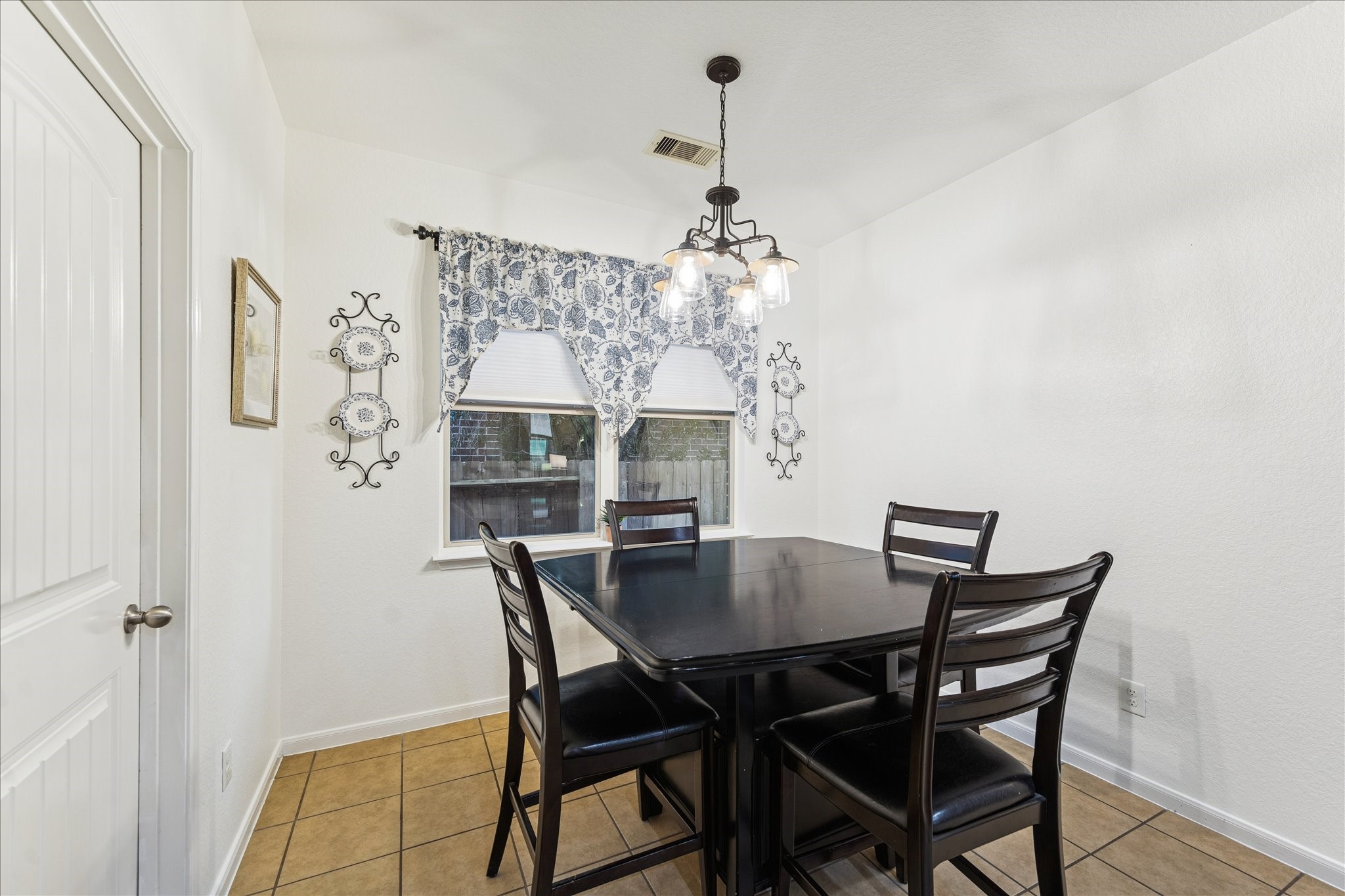 191 Maple Grove Drive Conroe, TX 77384 - Photo 14 of 31 a view of a dining room with a table and chairs
