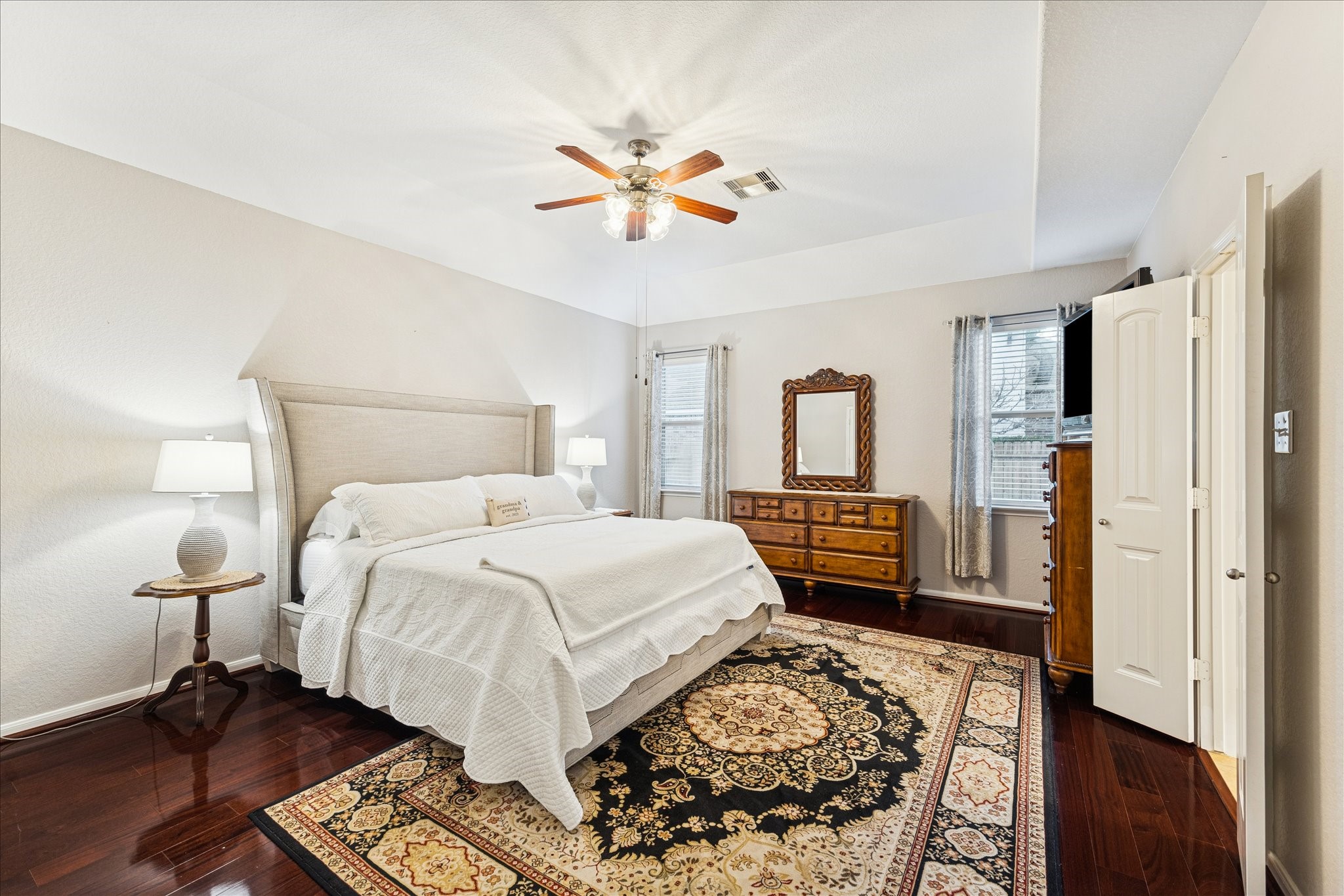 191 Maple Grove Drive Conroe, TX 77384 - Photo 15 of 31 a bedroom with a bed and wooden floor