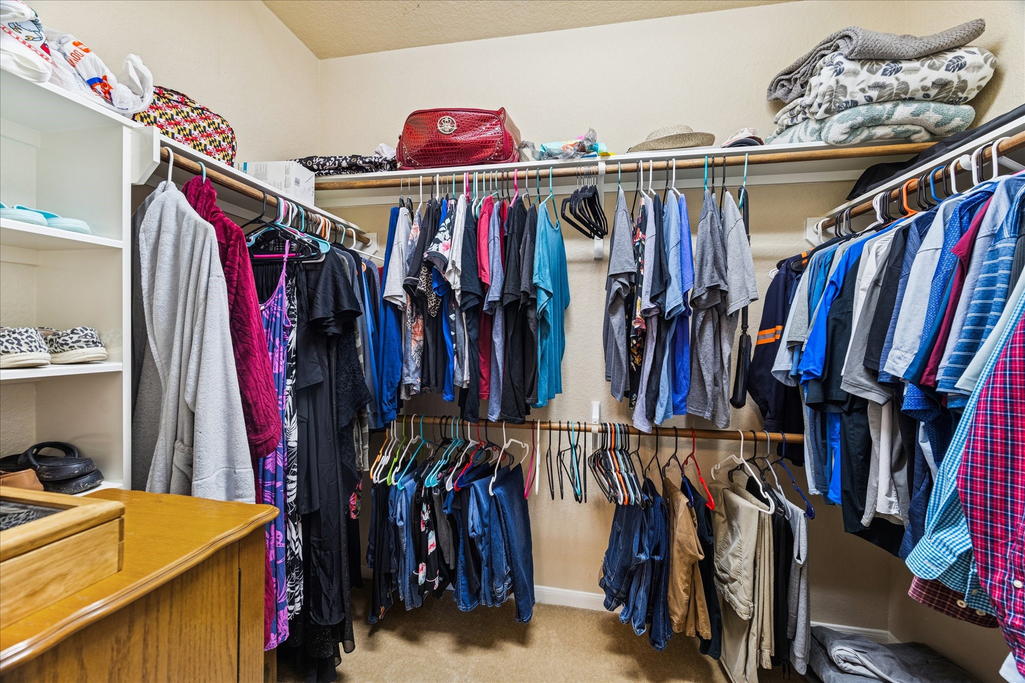 191 Maple Grove Drive Conroe, TX 77384 - Photo 19 of 31 a view of walk in closet with clothes