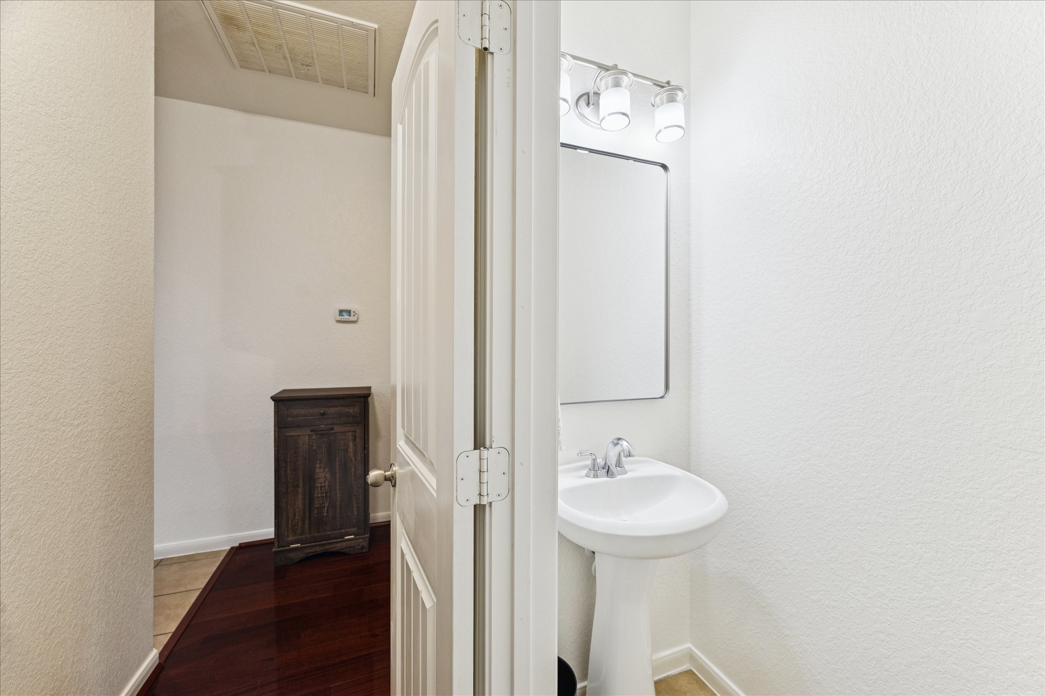 191 Maple Grove Drive Conroe, TX 77384 - Photo 20 of 31 a bathroom with a sink a toilet and shower
