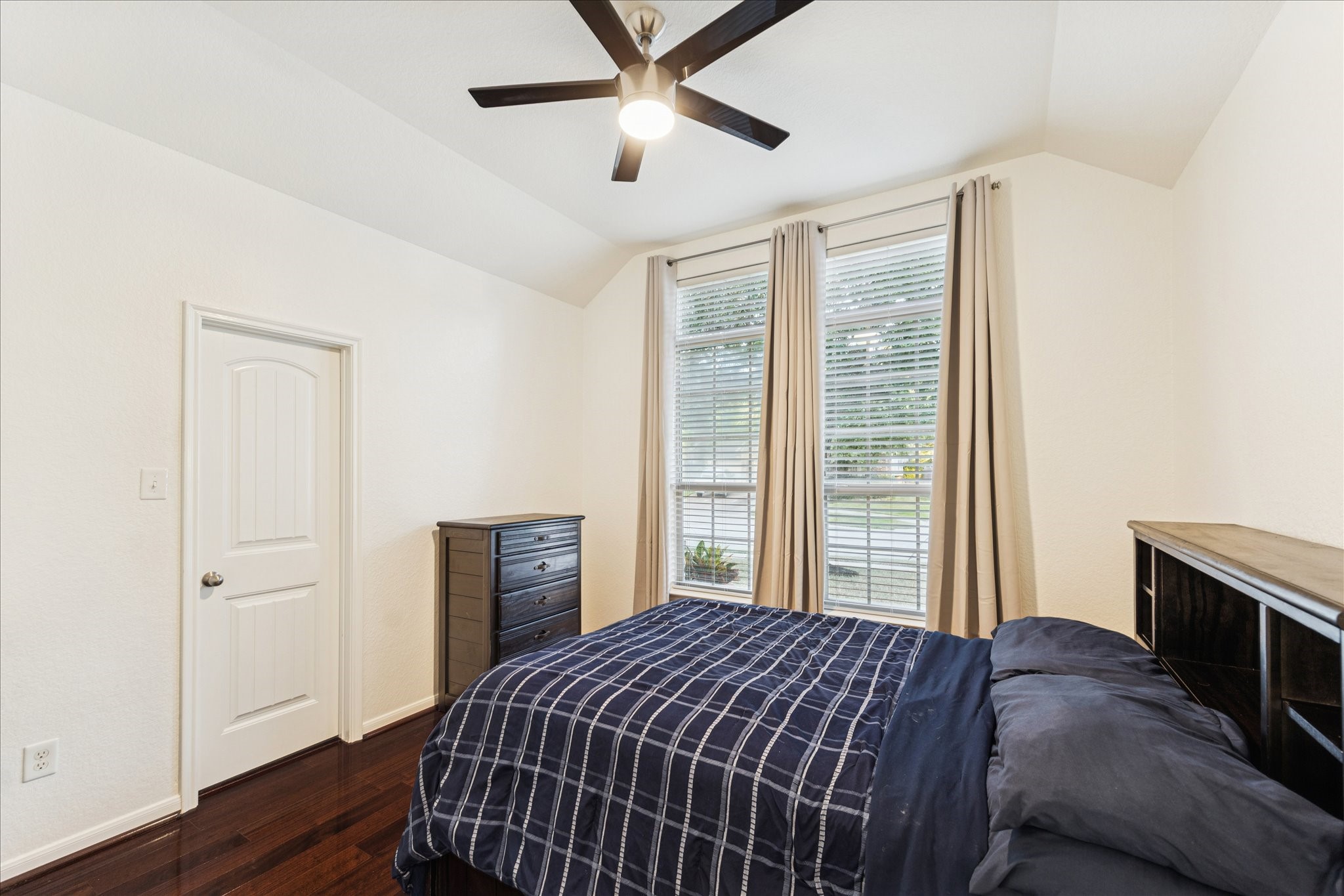 191 Maple Grove Drive Conroe, TX 77384 - Photo 21 of 31 a bedroom with a bed and wooden floor