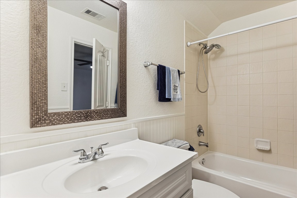 191 Maple Grove Drive Conroe, TX 77384 - Photo 28 of 31 a bathroom with a sink and a mirror