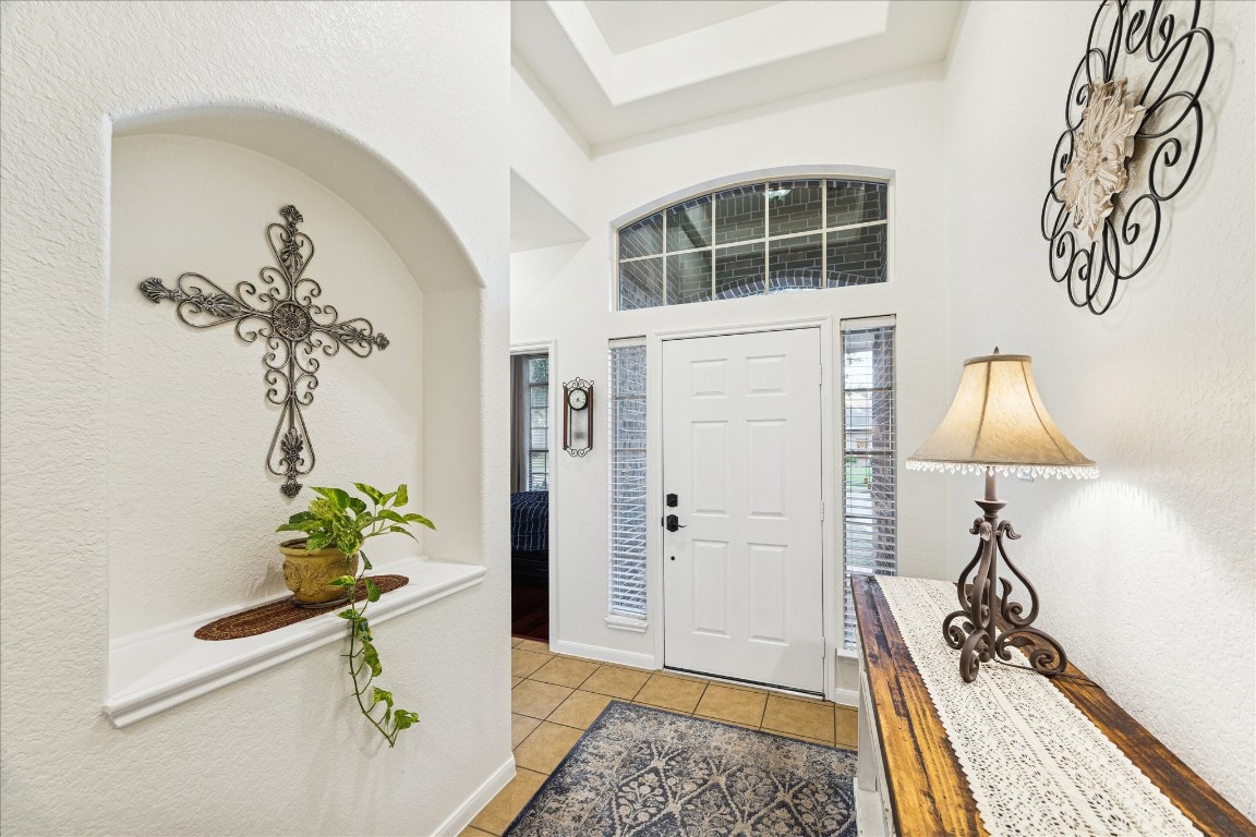 191 Maple Grove Drive Conroe, TX 77384 - Photo 3 of 31 a view of a bedroom with a potted plant