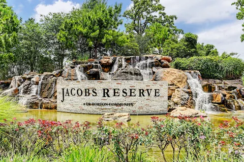 a view of outdoor space with signage and flags