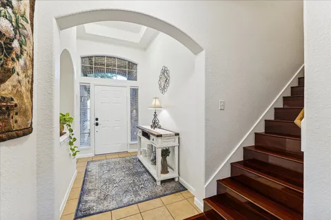 a view of an entryway with wooden floor