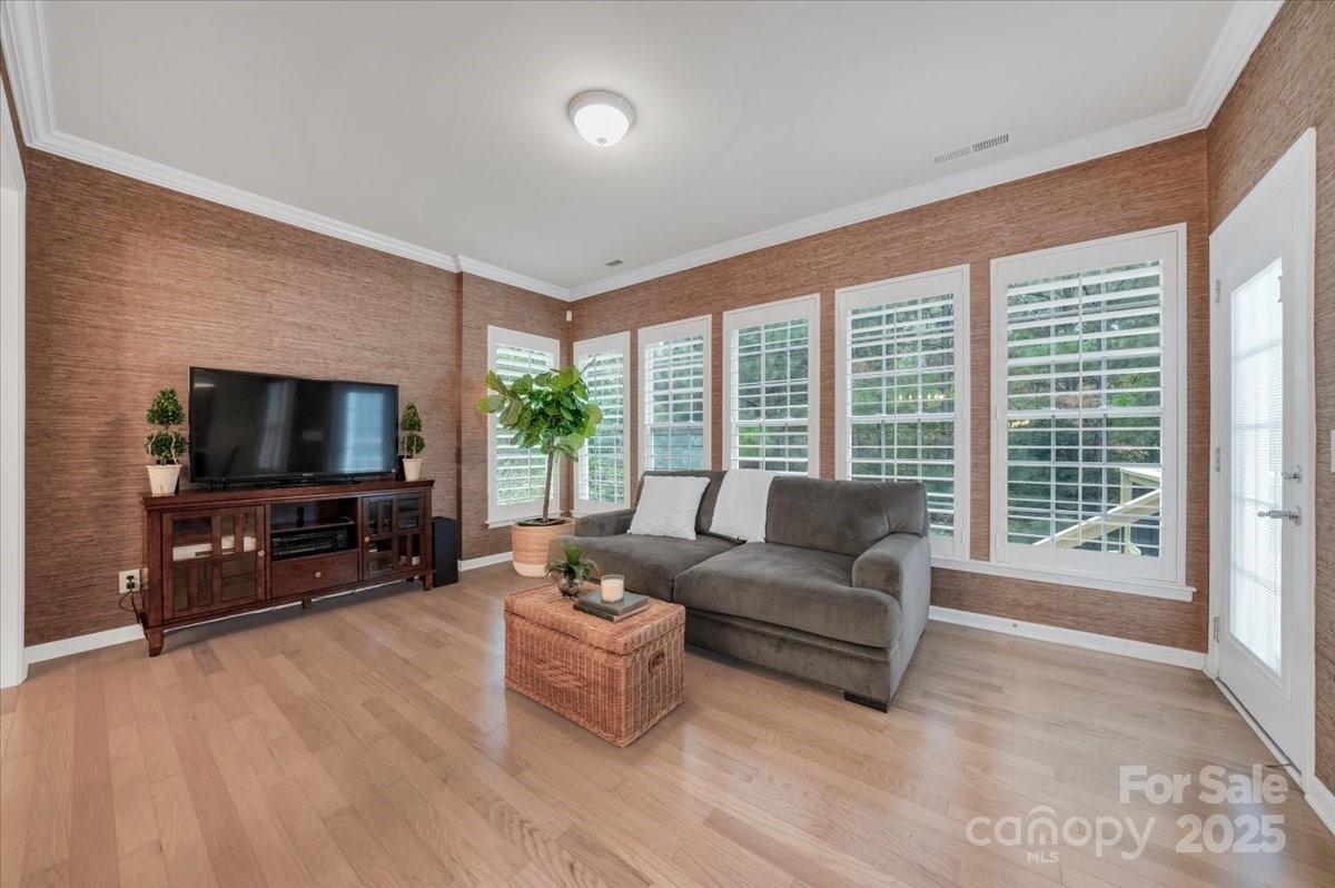 51225 Daffodil Court Fort Mill, SC 29707 - Photo 14 of 45 a living room with furniture a flat screen tv and a large window