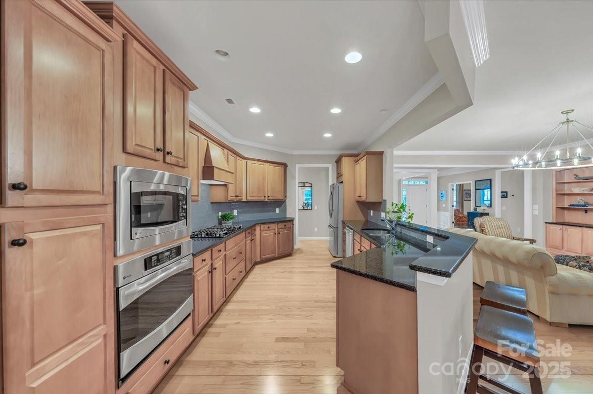 51225 Daffodil Court Fort Mill, SC 29707 - Photo 20 of 45 a kitchen with stainless steel appliances granite countertop a refrigerator and a stove top oven