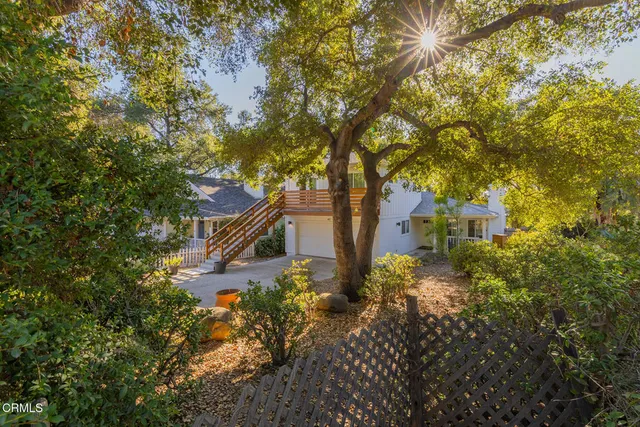 a view of a house with a tree