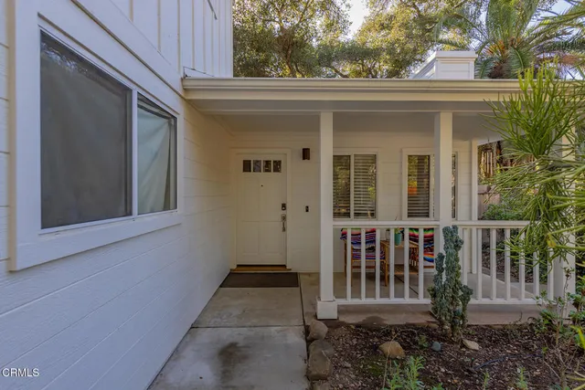 a view of outdoor space with balcony and furniture