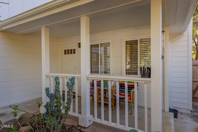 a view of a porch with wooden floor