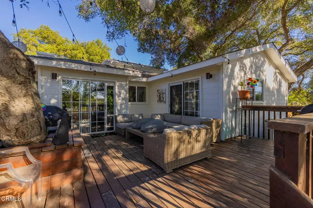 a view of balcony with wooden floor