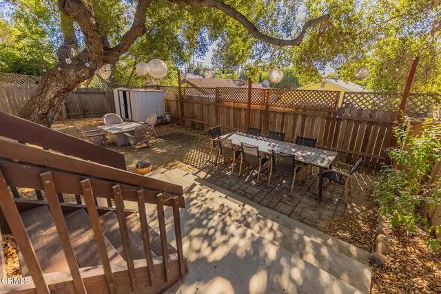 a view of a backyard with sitting area