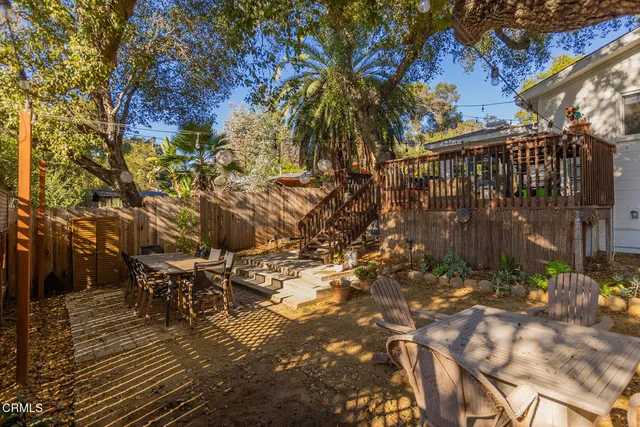 a living room with furniture a window and a fireplace