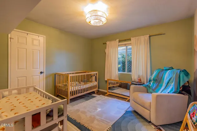 a bedroom with furniture and a window