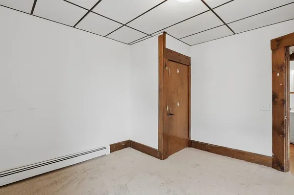 a view of a room with drop ceiling