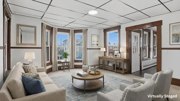 a living room with furniture and a large window