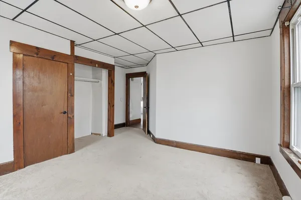 a view of a room with drop ceiling