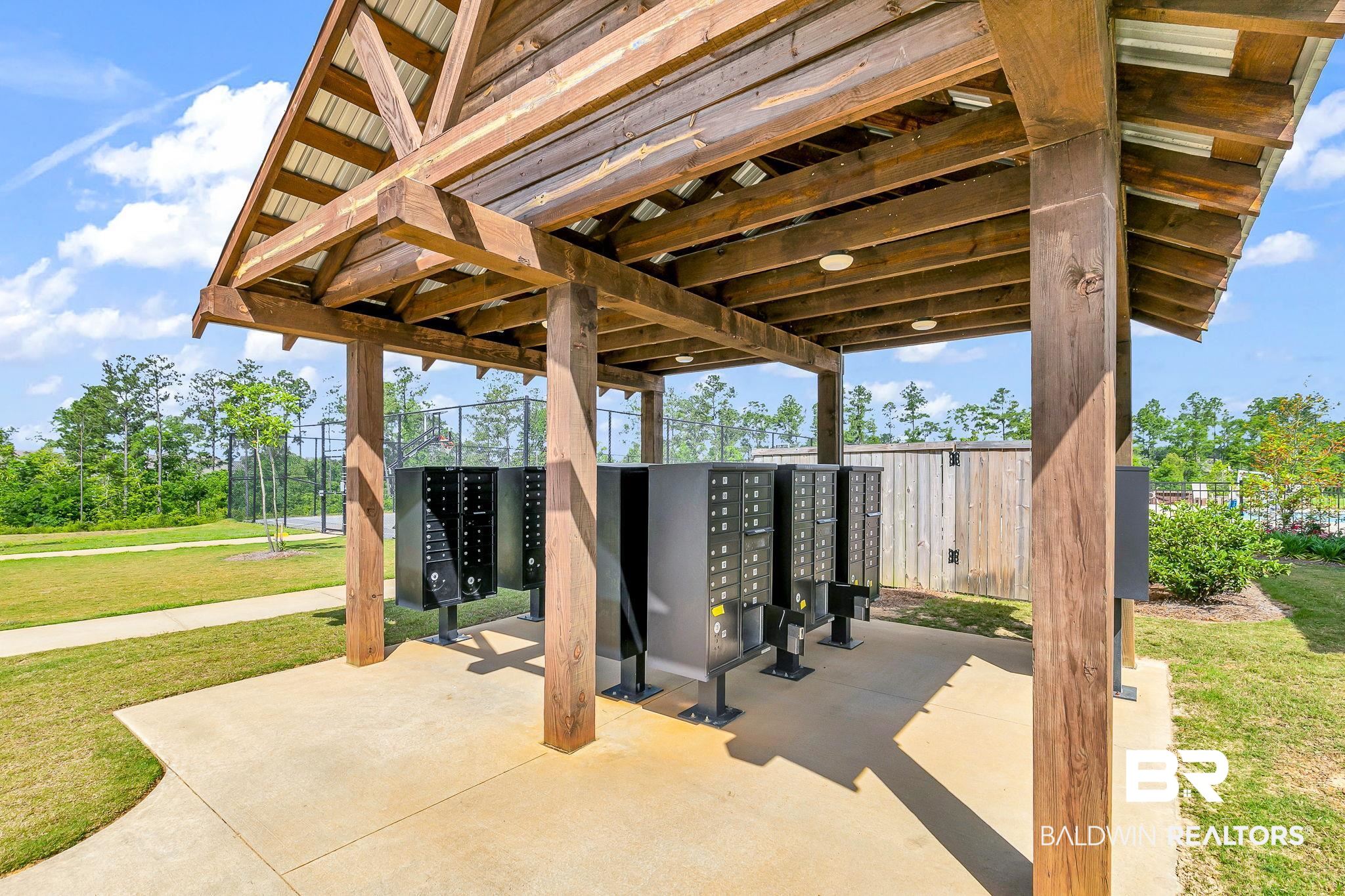 13233 Ibis Boulevard Daphne, AL 36527 - Photo 86 of 100 Covered community mailbox station featuring a wood-beam structure and metal roof