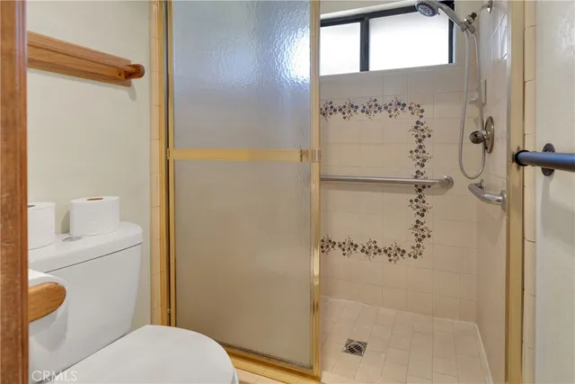 a bathroom with a shower and a toilet
