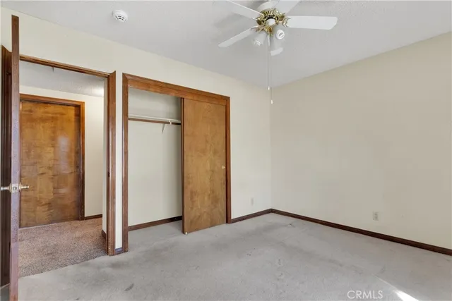 an empty room with a bathroom