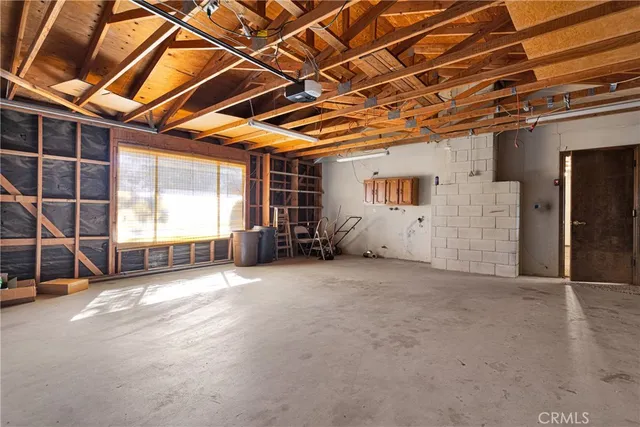 a view of a room with wooden walls