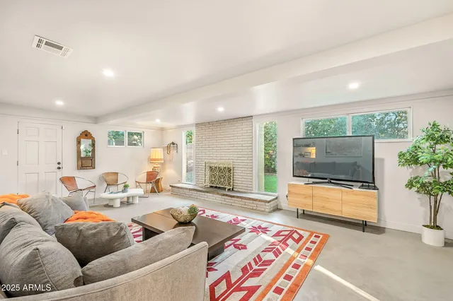 a living room with furniture and a table
