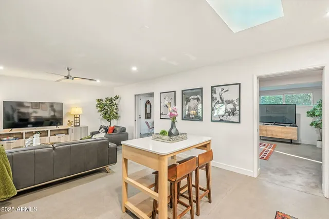 a kitchen with stainless steel appliances granite countertop a sink and cabinets