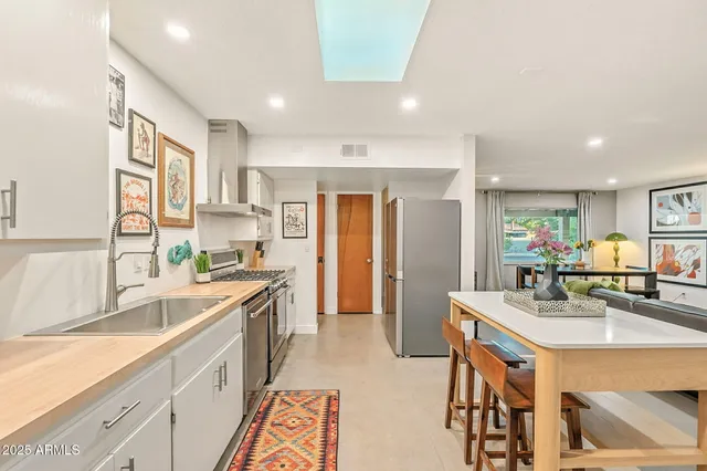 a bedroom with a bed and a chair