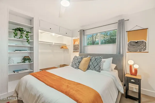 a bedroom with a bed and window