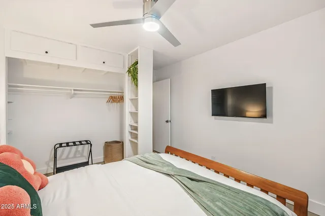 a view of a patio with table and chairs with wooden fence and plants