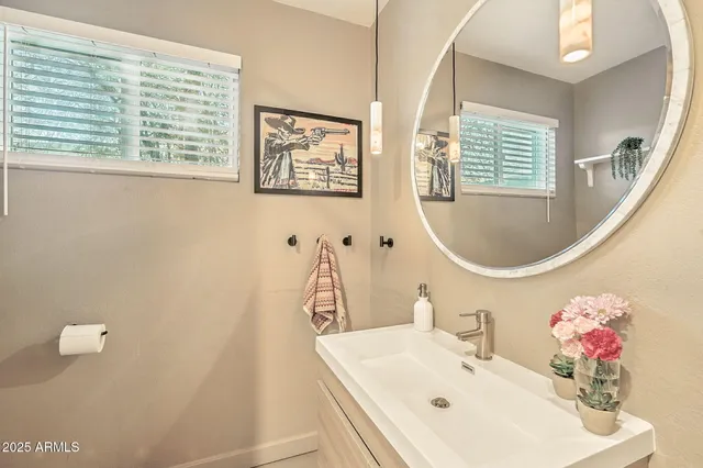 a backyard of a house with barbeque oven table and chairs