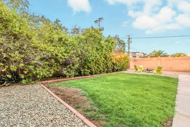 a view of a patio with table and chairs with wooden floor