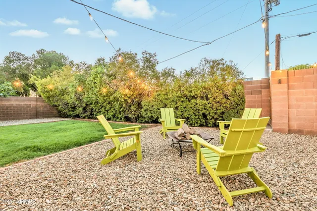a view of a house with backyard porch and furniture