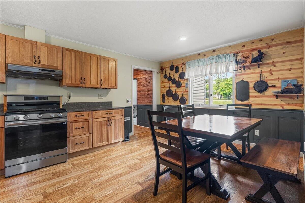 2522 Cindy Street Athens, TN 37303 - Photo 12 of 36 a kitchen with a table chairs stove and cabinets