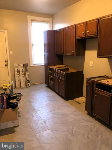 a kitchen with a stove and a refrigerator