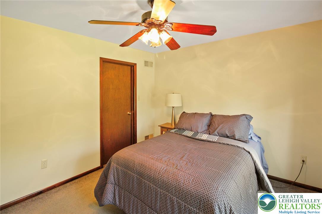 3470 Brodhead Road Bethlehem, PA 18020 - Photo 66 of 84 A comforting bedroom space, complete with soft carpet and a convenient ceiling fan.
