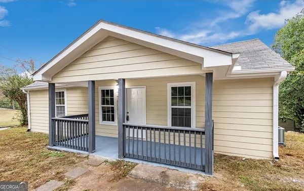 a front view of a house with a porch