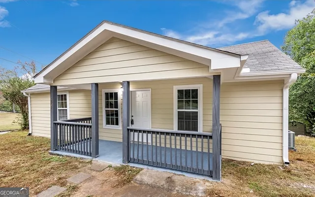 a front view of a house with a porch