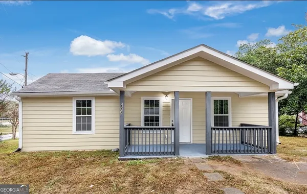 a front view of a house with a porch