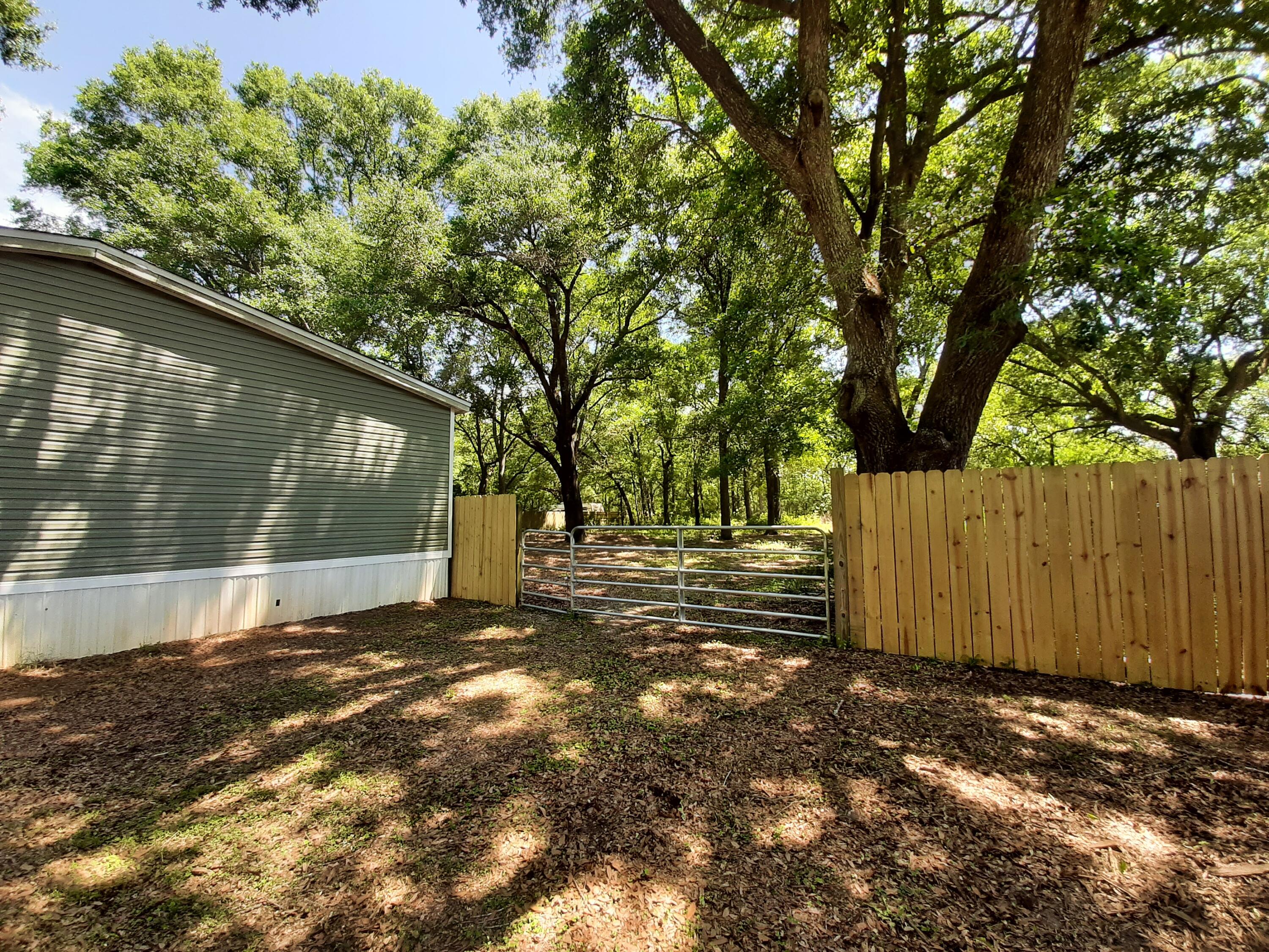 4030 Huckleberry Finn Road Milton, FL 32583 - Photo 8 of 31 h side gate