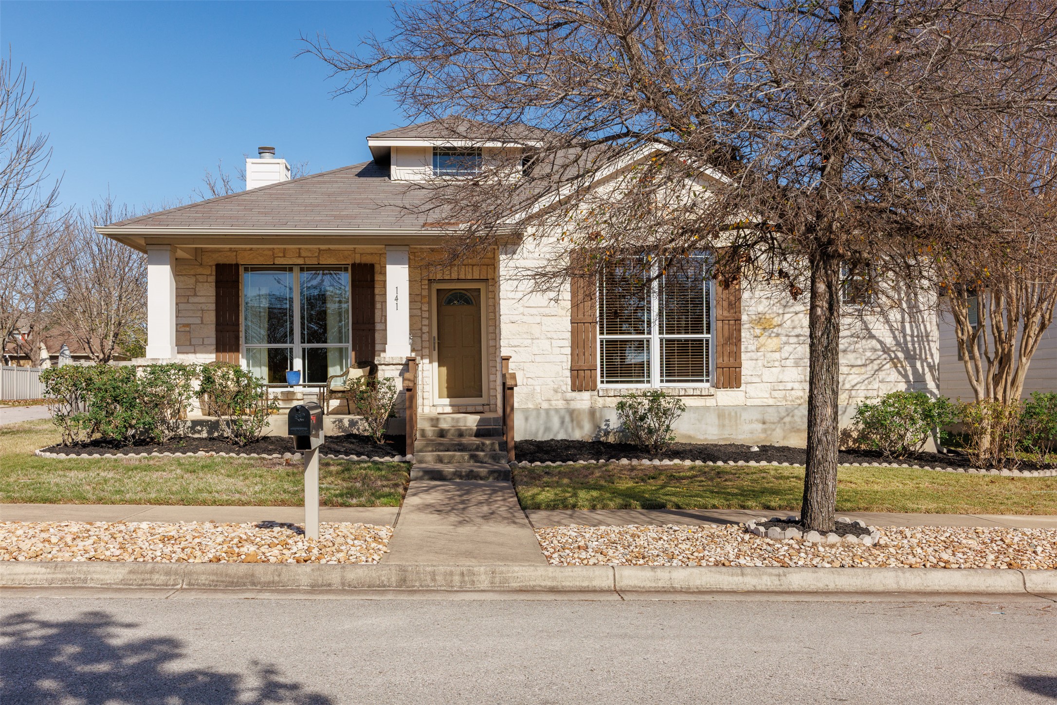Well-built one-story home with masonry stone exterior.