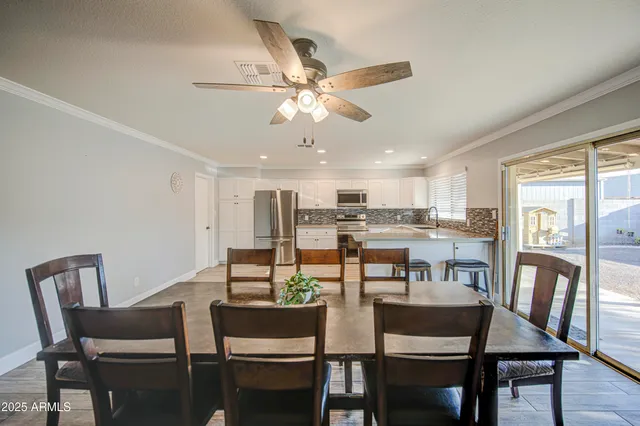 a dining room with furniture and window
